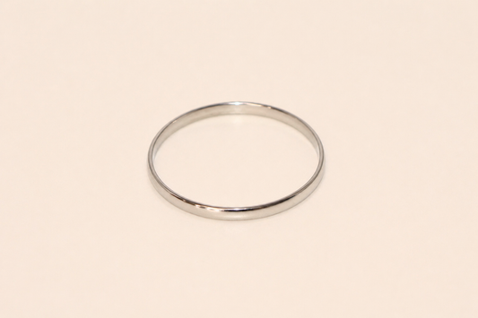 Silver bracelet on a beige background