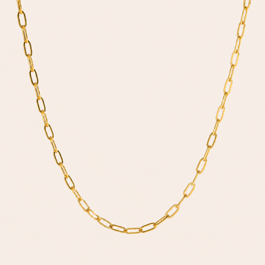 18k PVD Gold plated stainless steel Gold paperclip chain necklace on a beige background