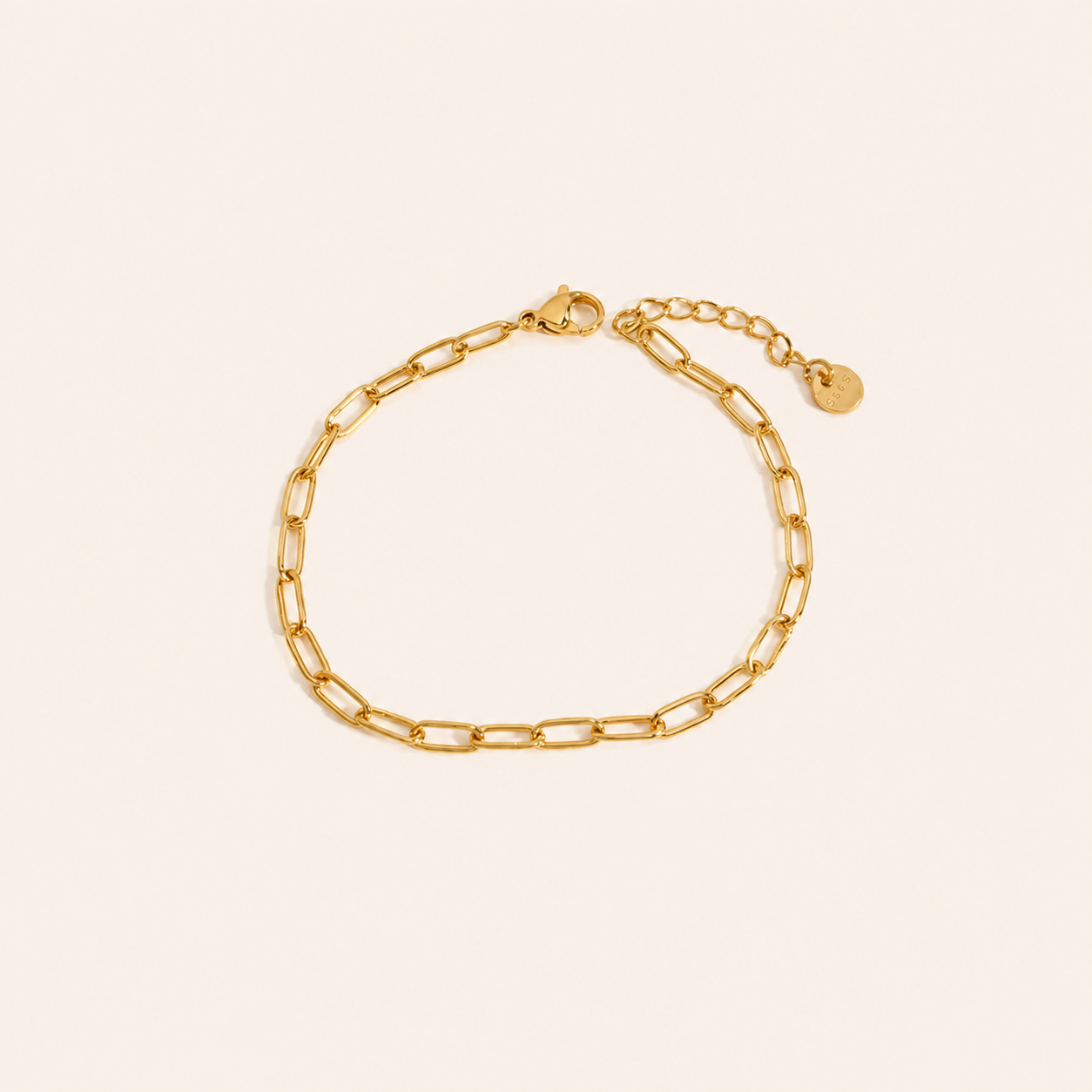 Waterproof Gold chain bracelet on a beige background